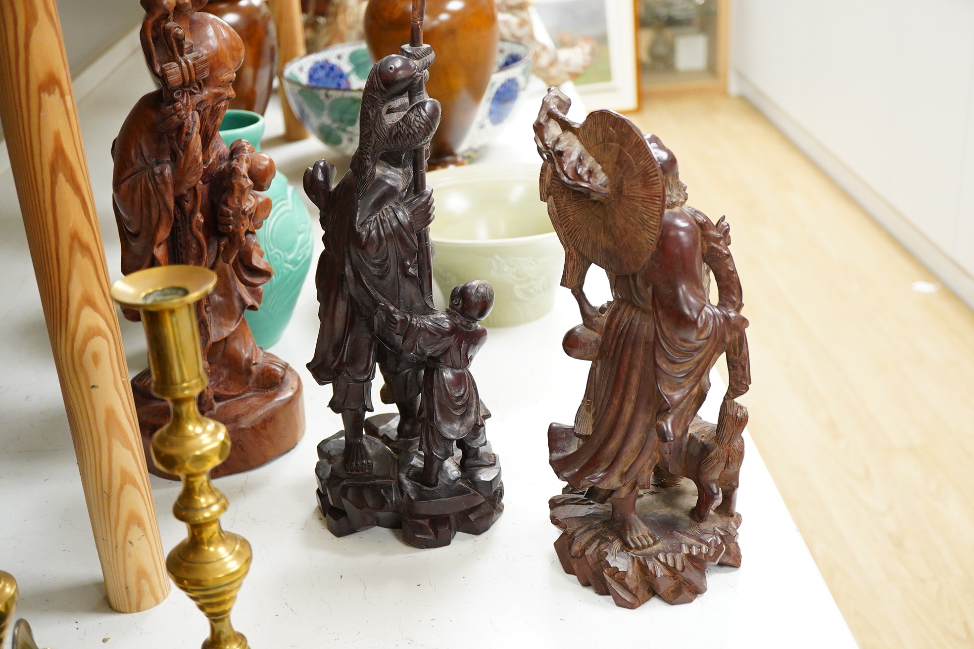 Three Chinese carved wood figures; Shou Lao, a fisherman and a Luohan, tallest 39cm